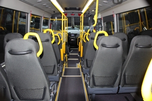 (Interior view of accessible city bus with foldable seats and ramp Iveco city front low entry  [de])