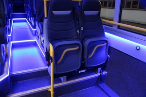 (Omnicar Interior view of accessible minibus iveco city bus with foldable seats and wheelchair  [de])