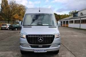 Front presentation of a new Mercedes minibus in VIP configuration, with panoramic tinted windows and AMG-style design